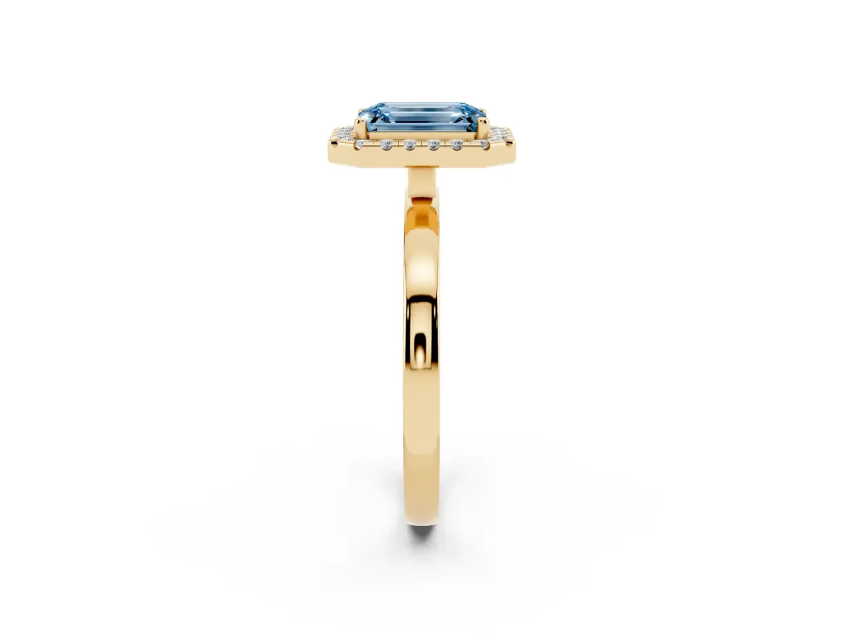 Fancy Blue Emerald Cut Halo Diamond Solitaire with Pavé Band and Four-Prong Setting Yellow gold