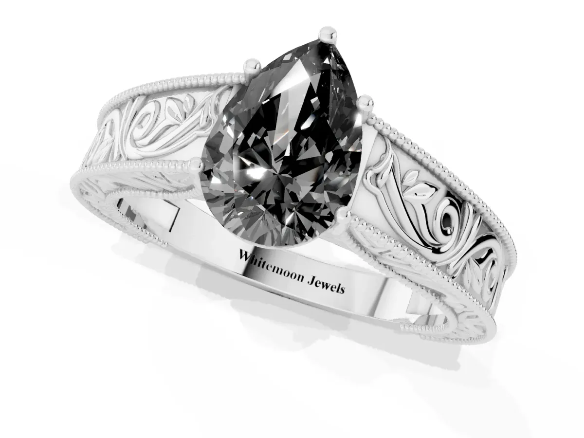 Fancy Black Pear Cut Diamond Solitaire Ring with Engraved Band and Four-Prong Setting Platinum