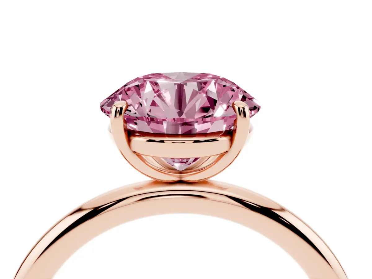 Fancy Pink Round Cut Solitaire Diamond Ring with Four-Prong Setting on a Plain Band Rose gold