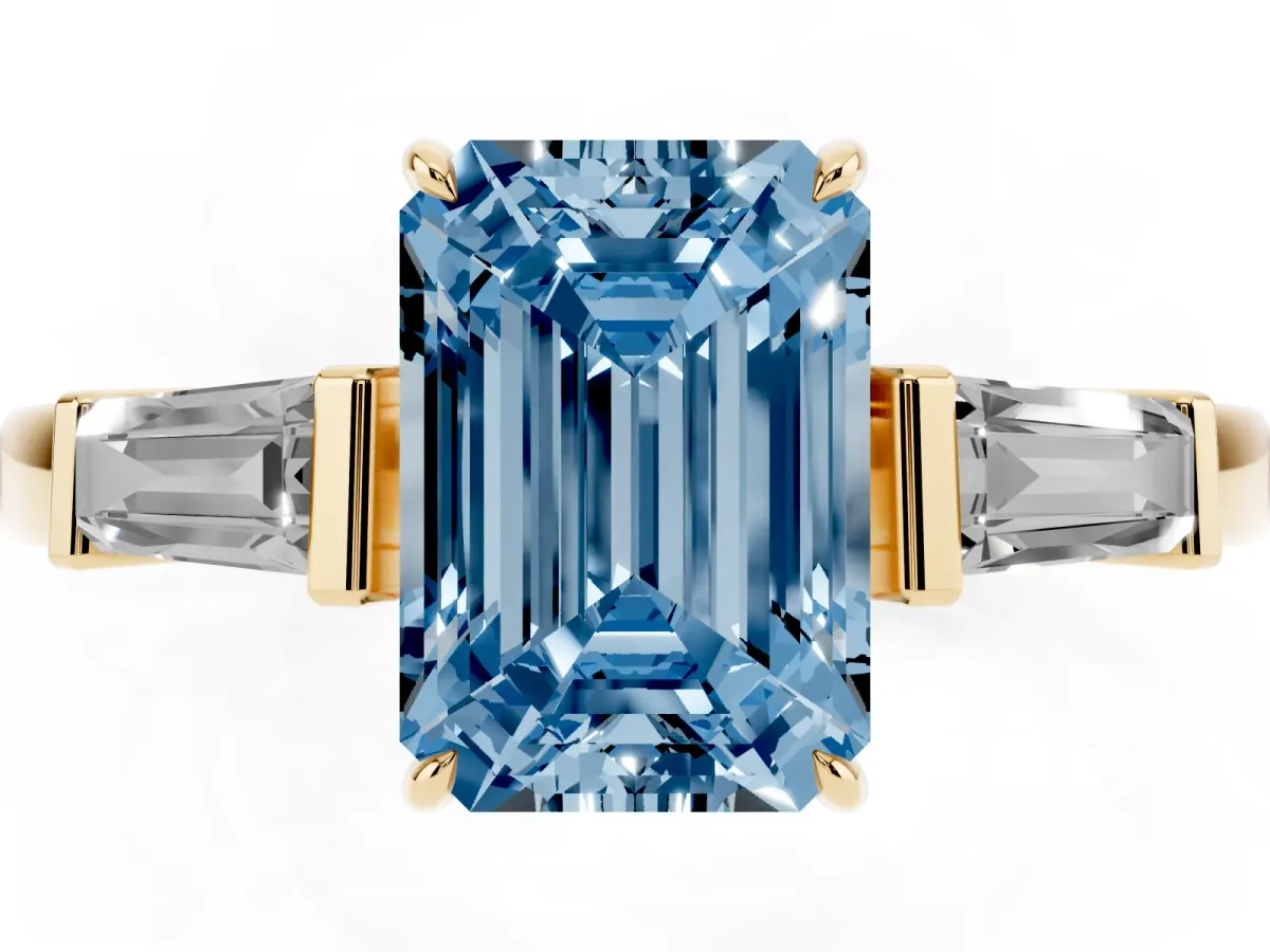 Fancy Blue Emerald Cut Diamond Three-Stone Ring with Tapered Baguette Side Stones and Prong Setting Yellow gold