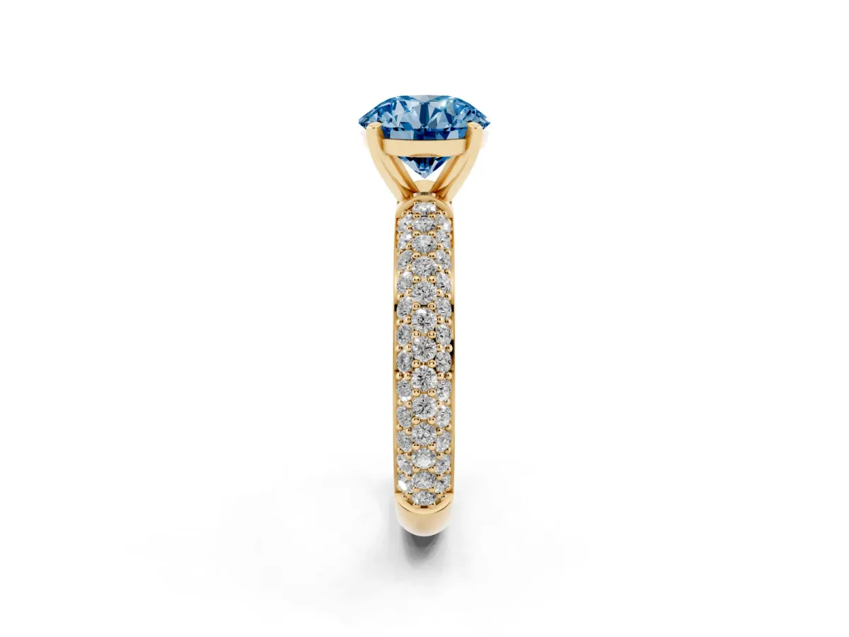 Fancy Blue Round Cut Diamond Solitaire Ring with Prong Setting and Pavé Band Yellow gold