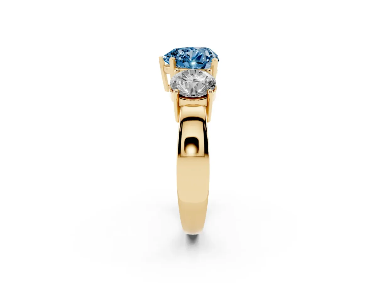 Fancy Blue Three-Stone Heart Cut Diamond Ring with Round Side Stones, Classic Band, and Four-Prong Setting Yellow gold