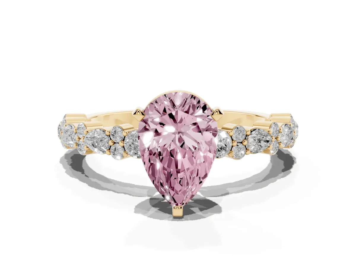 Fancy Pink Pear Cut Diamond Side Stone Solitaire Ring with Round and Four-Prong Setting Yellow gold