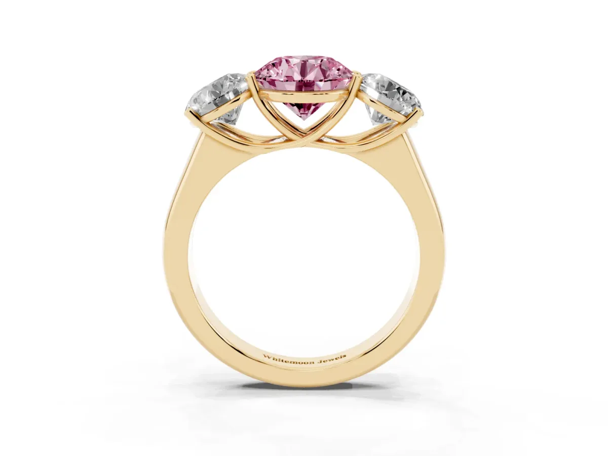 Fancy Pink Round Cut Three-Stone Diamond Ring with Prong Setting on a Classic Band Yellow gold