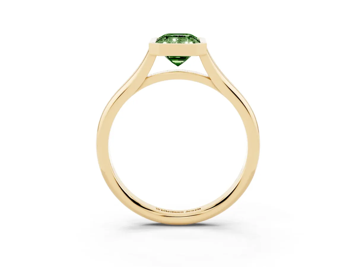 Fancy Green Bezel Set Emerald Cut Cut Solitaire Ring with Tapered Band Yellow gold