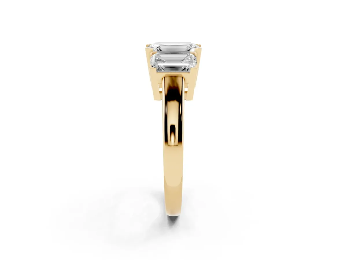 Three-Stone Emerald Cut Cut Diamond Ring with Channel Set Band and Four-Prong Setting Yellow gold