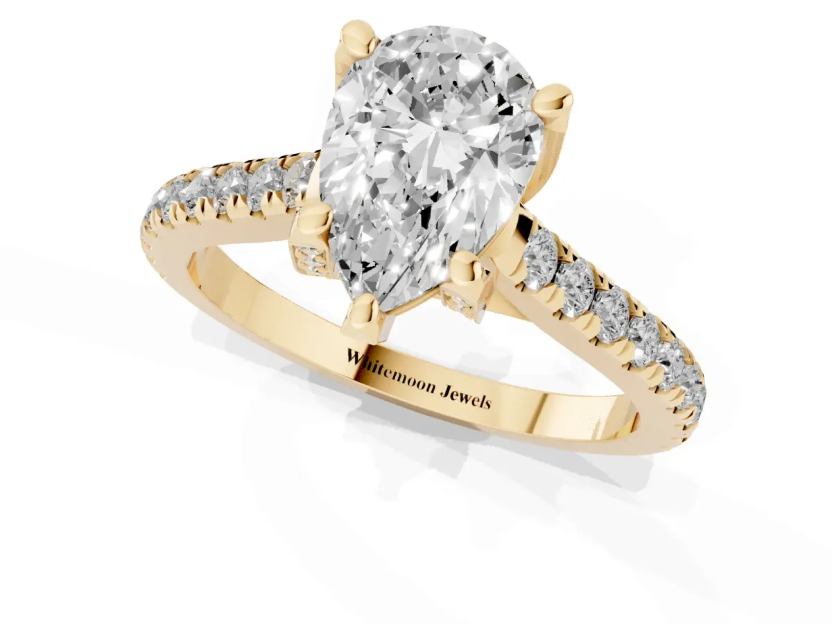 Pear Cut Brilliant Diamond Solitaire with Pavé Band and Four-Prong Setting Yellow gold