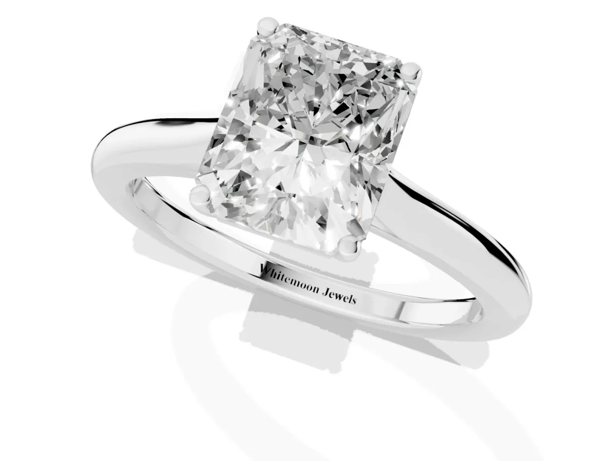 Radiant Cut Cut Solitaire Ring with Cathedral Band and Four-Prong Setting Silver