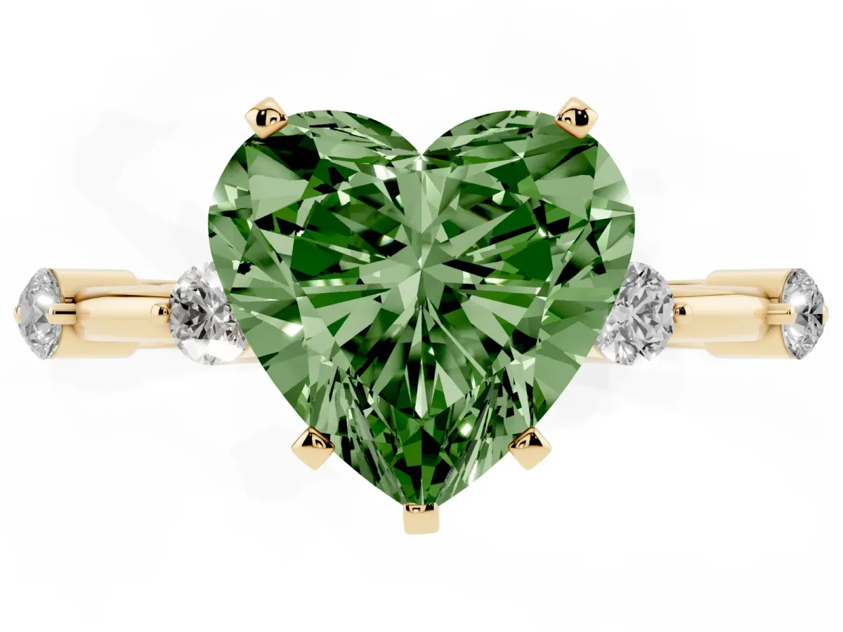 Fancy Green Heart Cut Solitaire Diamond Ring with Bezel Set Side Stones and Prong Setting Yellow gold