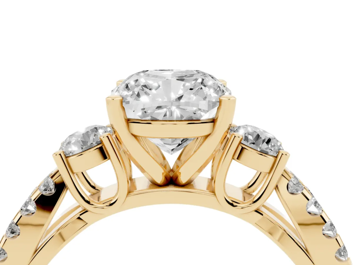 Cushion Cut Diamond Three-Stone Ring with Pavé Split Shank and Four-Prong Setting Yellow gold