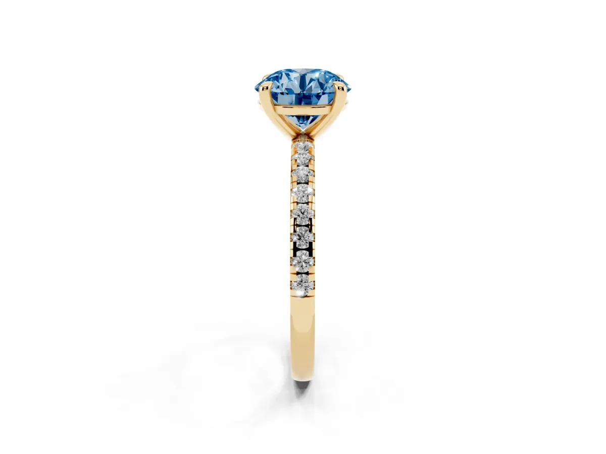 Fancy Blue Round Cut Diamond Brilliant Solitaire Ring with Pavé Band and Four-Prong Setting Yellow gold