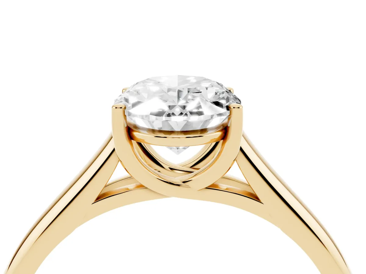 Oval Cut Solitaire Engagement Ring with Tapered Band and Four-Prong Setting Yellow gold
