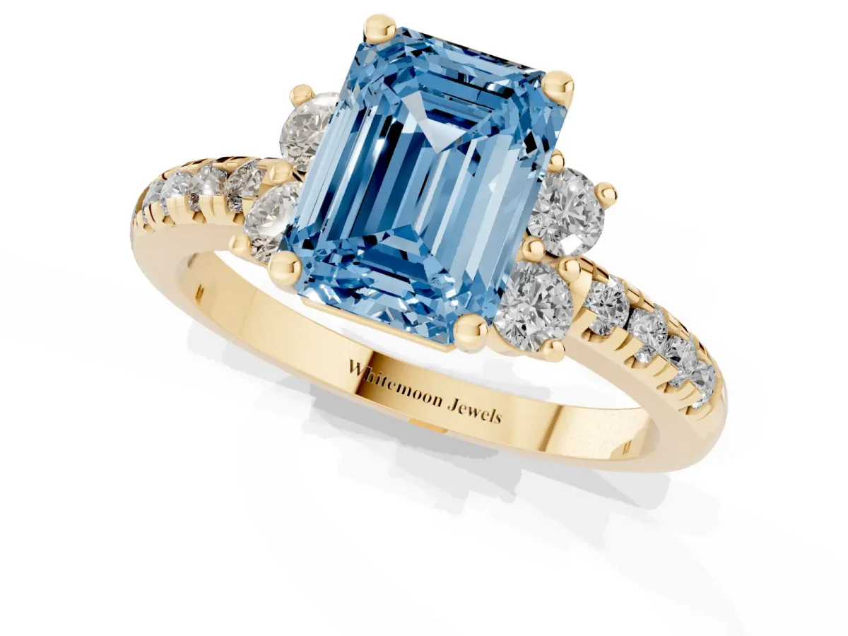 Fancy Blue Emerald Cut Diamond Three-Stone Pave Band with Four-Prong Setting Yellow gold