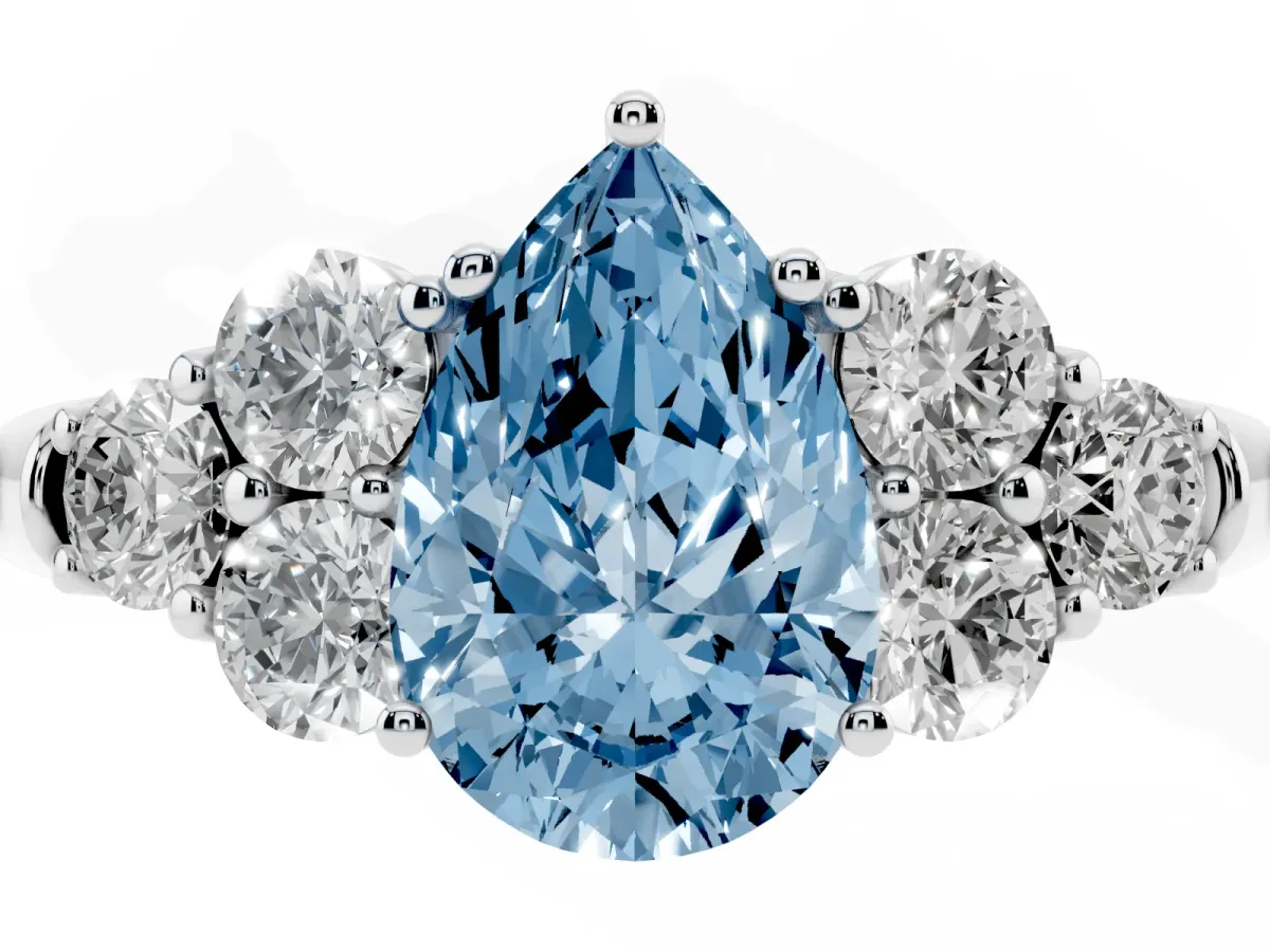 Fancy Blue Pear Cut Cut Diamond Cluster Ring with Round Accent Stones and Prong Setting on a Classic Band White gold
