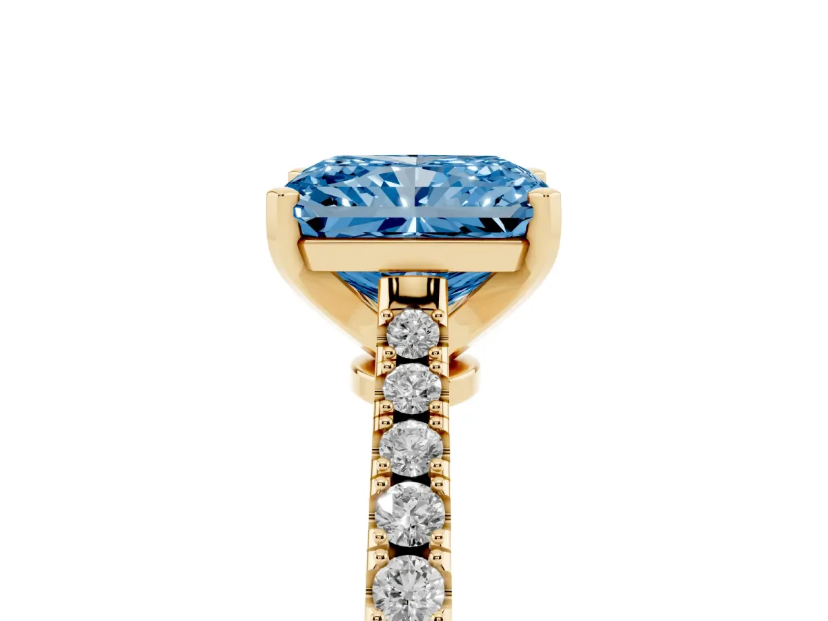 Fancy Blue Radiant Cut Cut Solitaire Diamond Engagement Ring with Pave Band and Four-Prong Setting Yellow gold