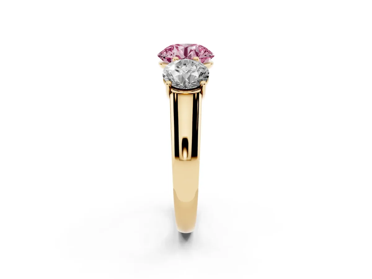 Fancy Pink Round Cut Three-Stone Diamond Ring with Prong Setting on a Classic Band Yellow gold