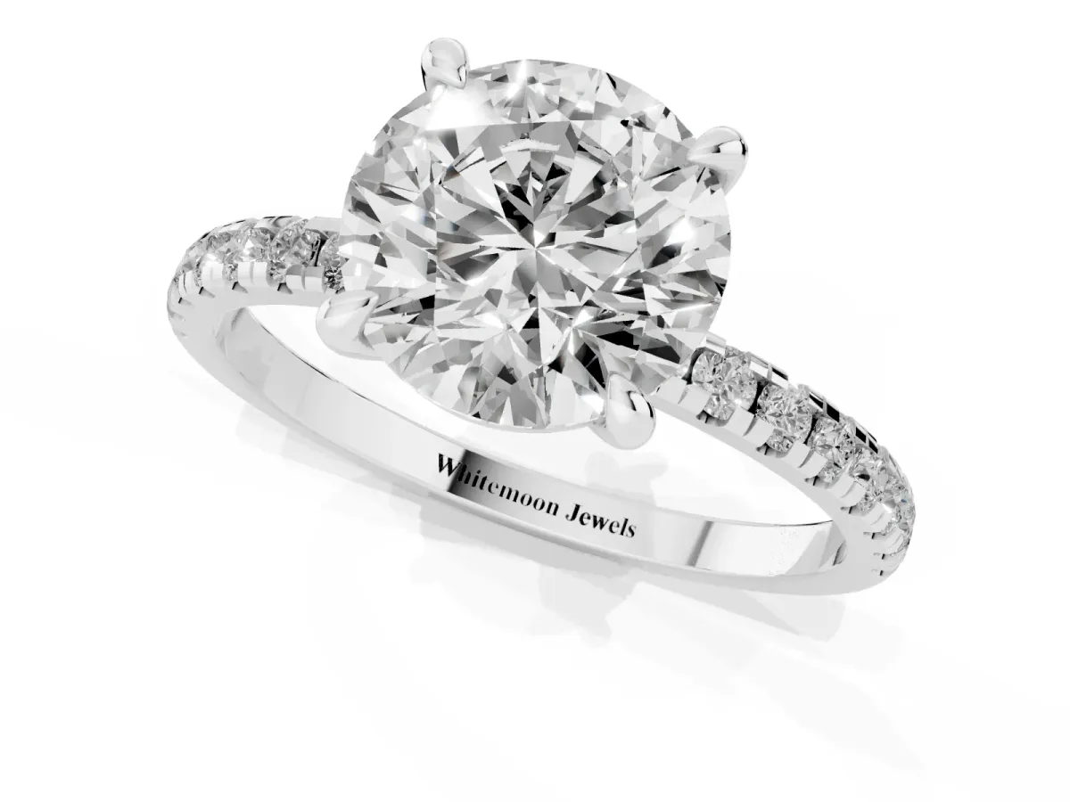 Round Cut Diamond Brilliant Solitaire Ring with Pavé Band and Four-Prong Setting Silver