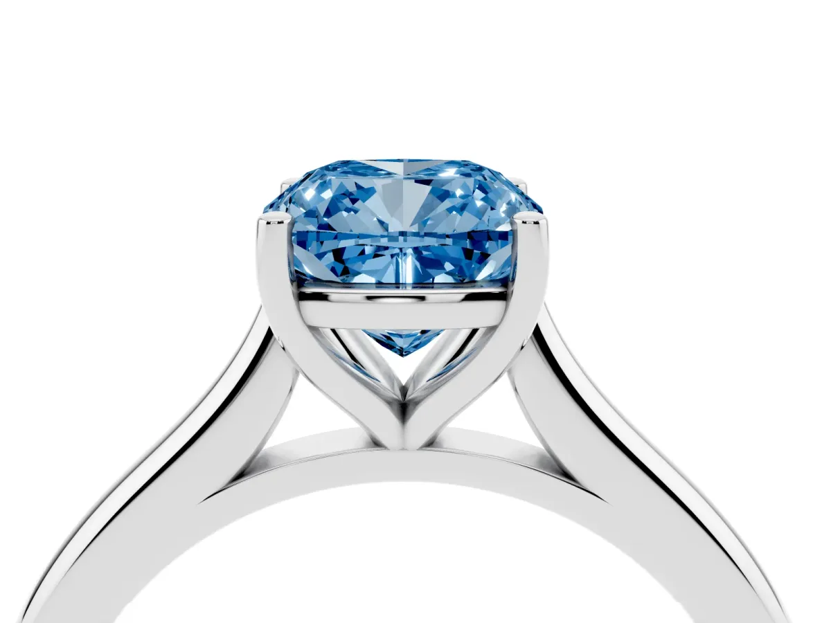 Fancy Blue Cushion Cut Cut Solitaire Ring with Cathedral Band and Four-Prong Setting Silver