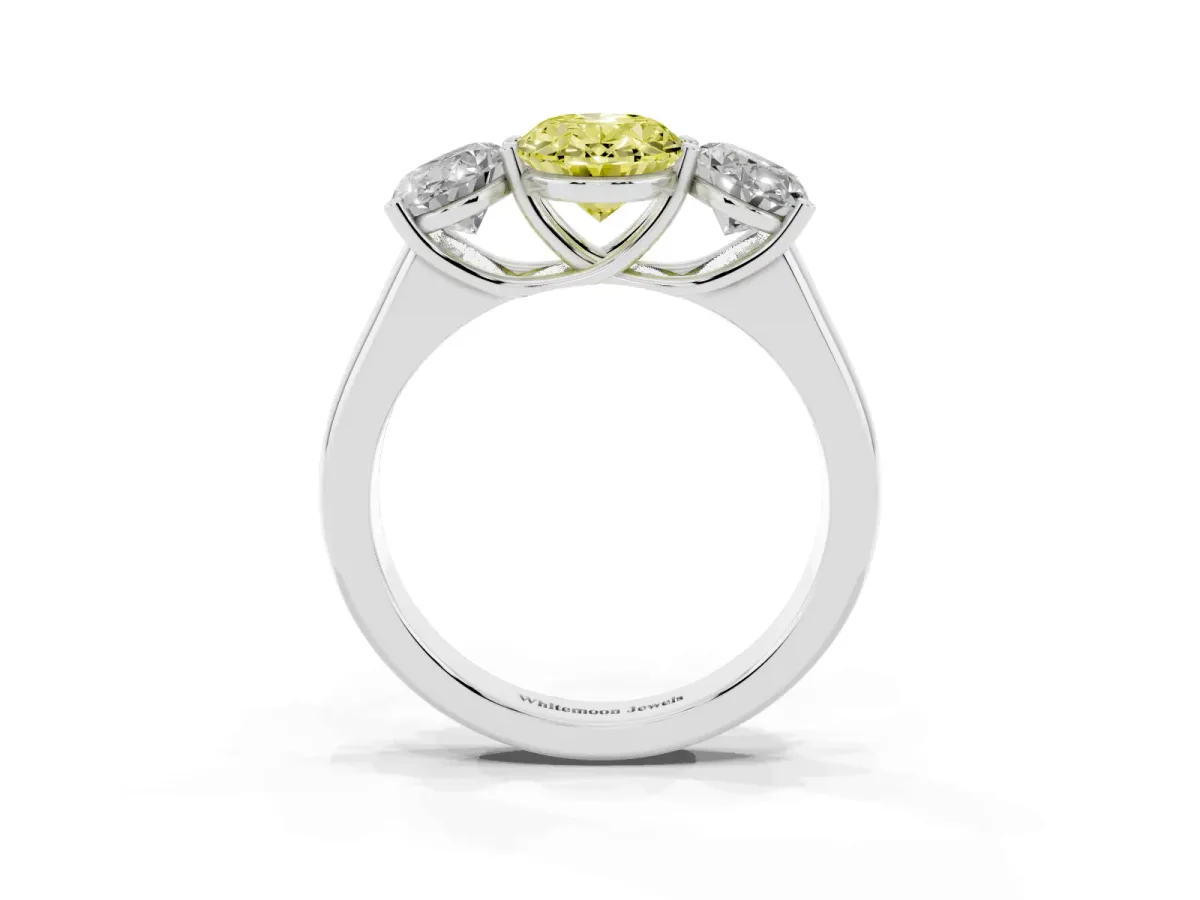 Fancy Yellow Oval Cut Three-Stone Diamond Ring with Prong Setting on a Classic Band Platinum