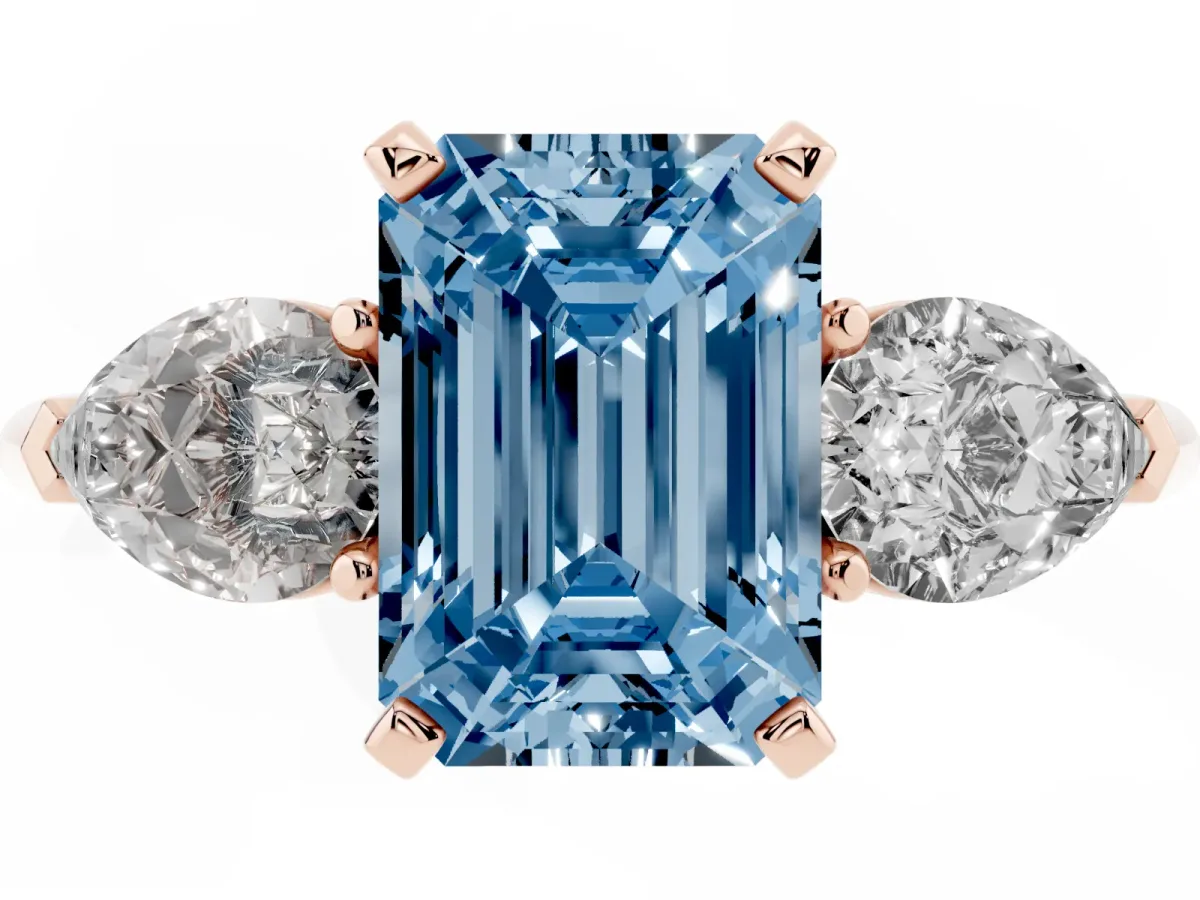 Fancy Blue Three-Stone Emerald Cut Diamond Ring with Pear Side Stones and Four-Prong Setting Rose gold