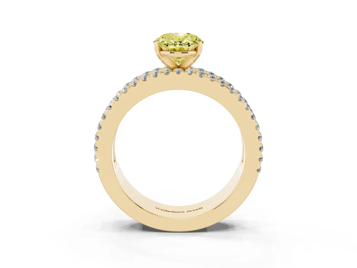 Fancy Yellow Oval Cut Diamond Solitaire Ring with Pavé and Channel Set Band Yellow gold