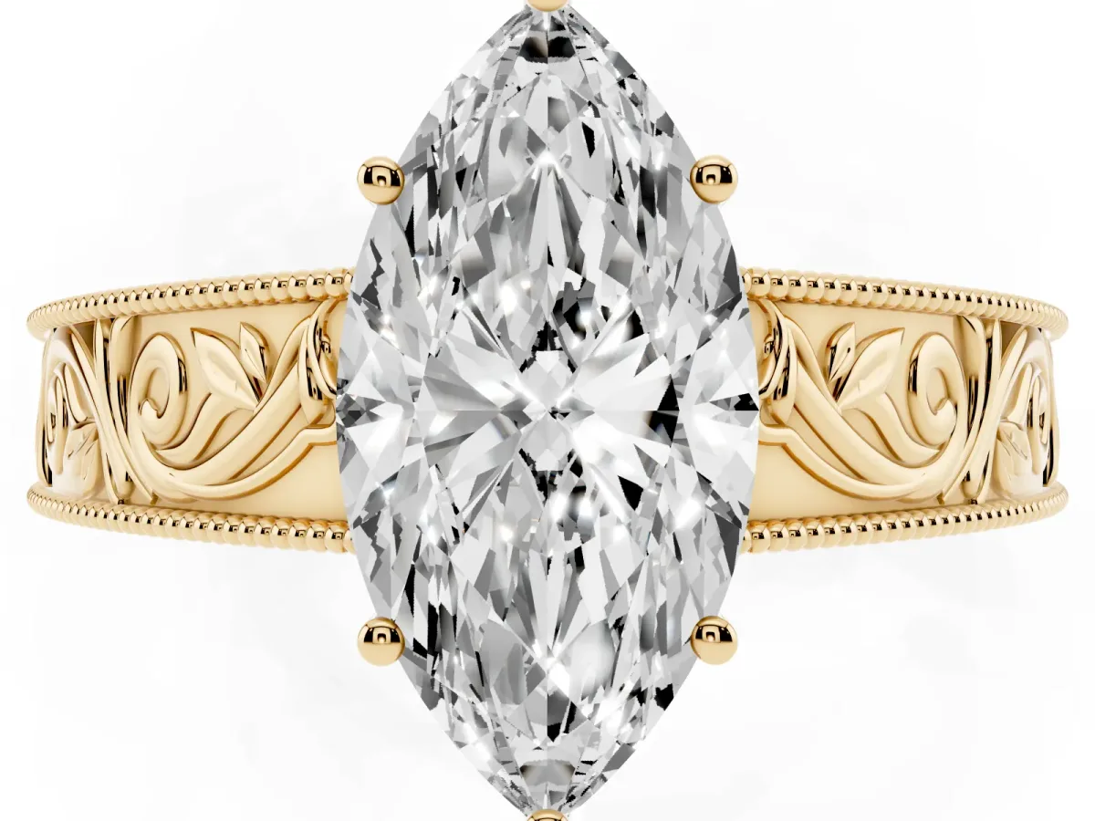 Marquise Cut Diamond Solitaire Ring with Engraved Band and Four-Prong Setting Yellow gold
