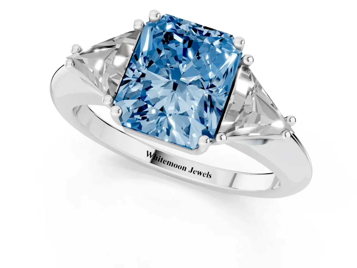 Fancy Blue Three-Stone Radiant Cut Diamond Engagement Ring with Trillion Side Stones and Prong Setting Silver