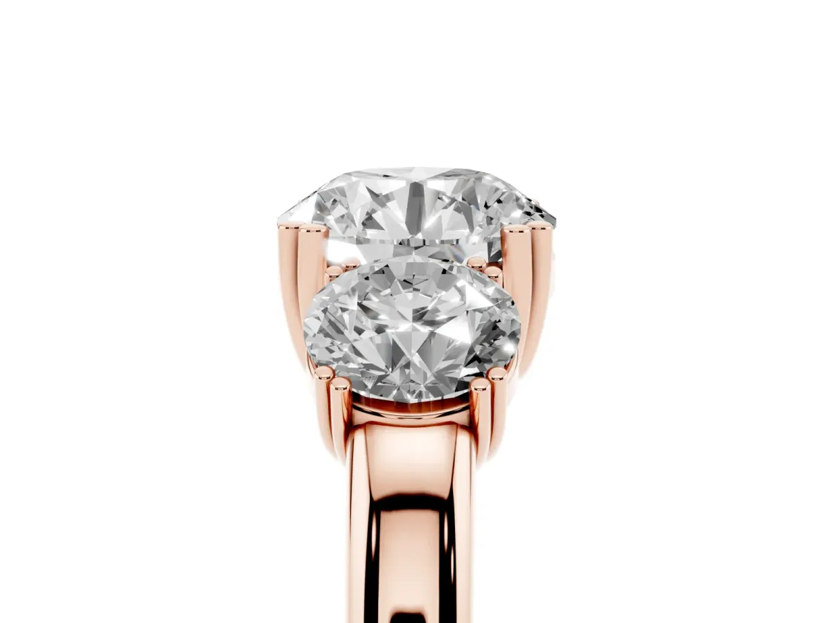 Three-Stone Round Cut Cut Diamond Ring with Channel Set Band and Four-Prong Setting Rose gold