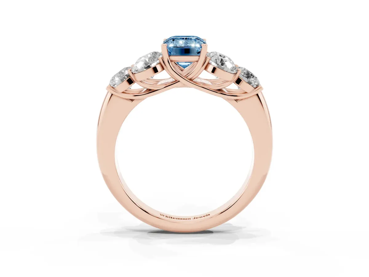 Fancy Blue Emerald Cut Cut Diamond Cluster Ring with Round Accent Stones and Prong Setting on a Classic Band Rose gold