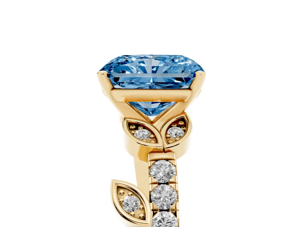 Fancy Blue Radiant Cut Solitaire Leaf-Inspired Diamond Ring with Pavé Band and Four-Prong Setting Yellow gold