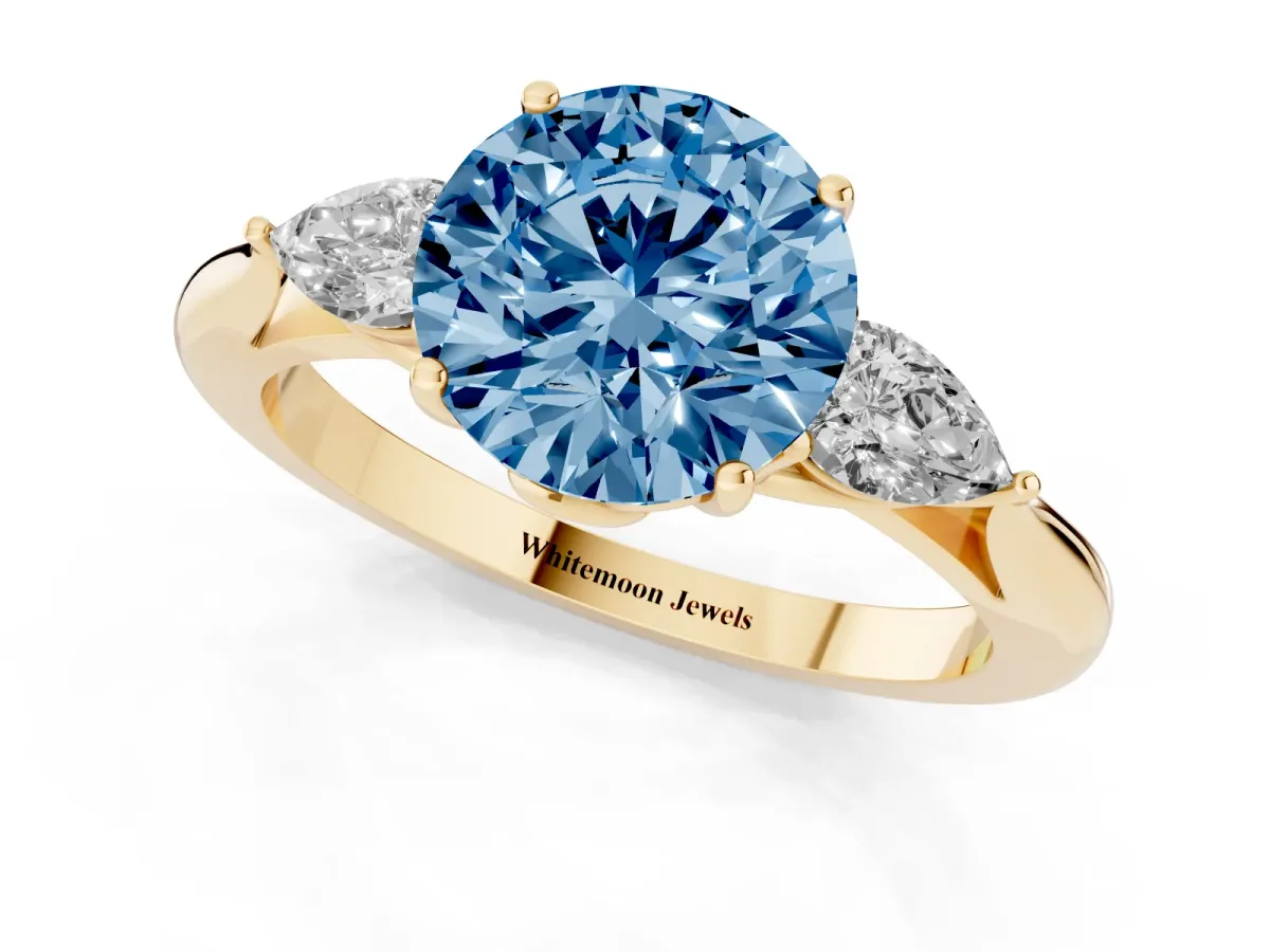 Fancy Blue Three-Stone Round Cut Brilliant Diamond Solitaire Ring with Tapered Band and Four-Prong Setting Yellow gold