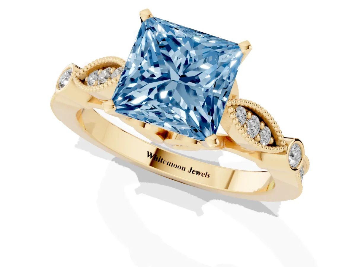 Fancy Blue Princess Cut Cut Diamond with Milgrain Marquise and Bezel Accents on a Solitaire Band with Prong Setting Yellow gold