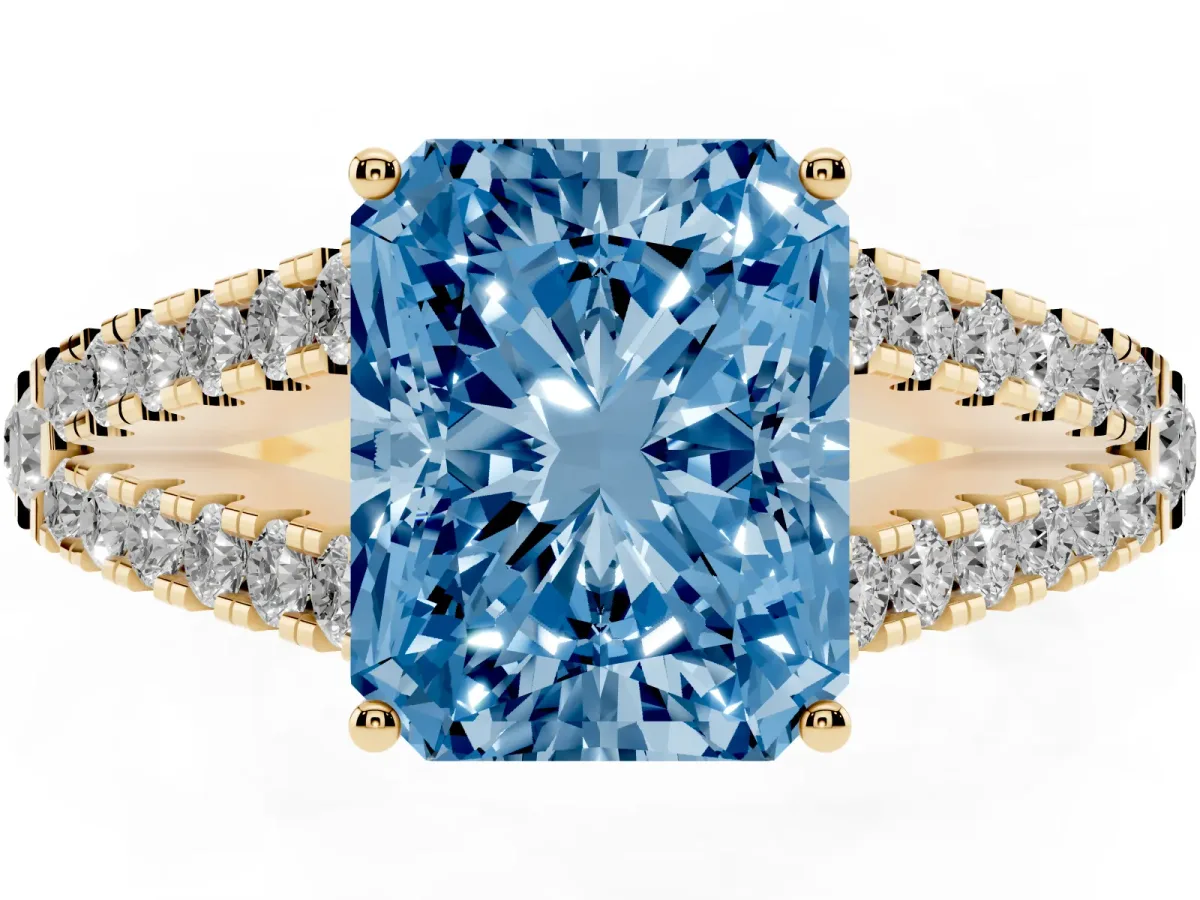 Fancy Blue Radiant Cut Diamond Split Shank Engagement Ring with Round Pavé and Prong Setting Yellow gold