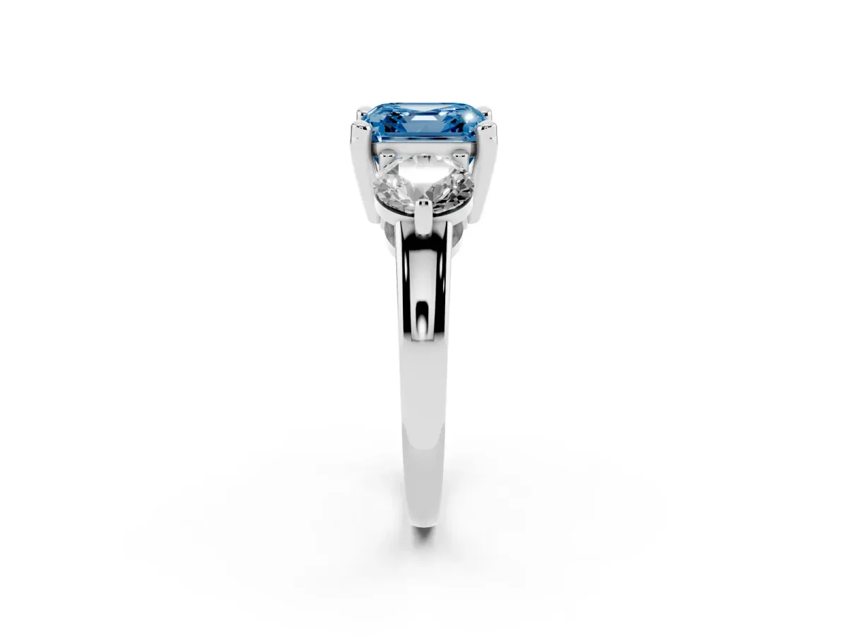 Fancy Blue Three-Stone Asscher Cut Brilliant Cut Solitaire Ring with Prong Setting on a Classic Band Platinum