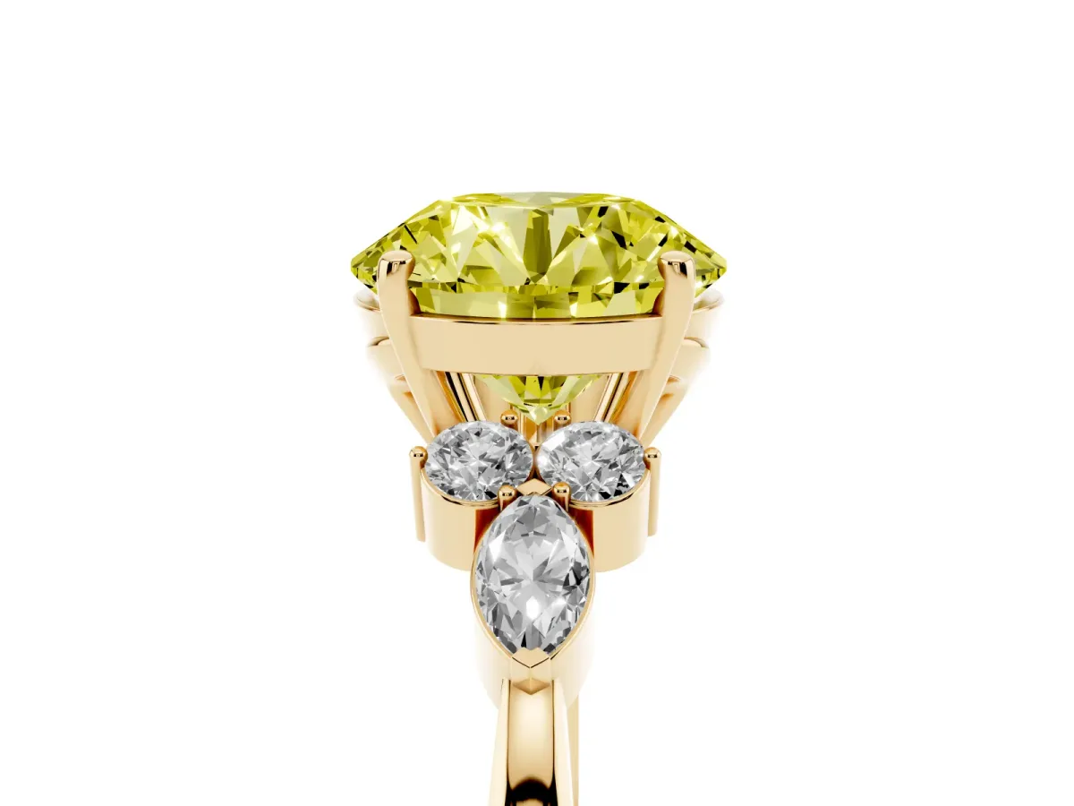 Fancy Yellow Round Cut Brilliant Diamond Solitaire Ring with Pear Side Stones and Four-Prong Setting Yellow gold