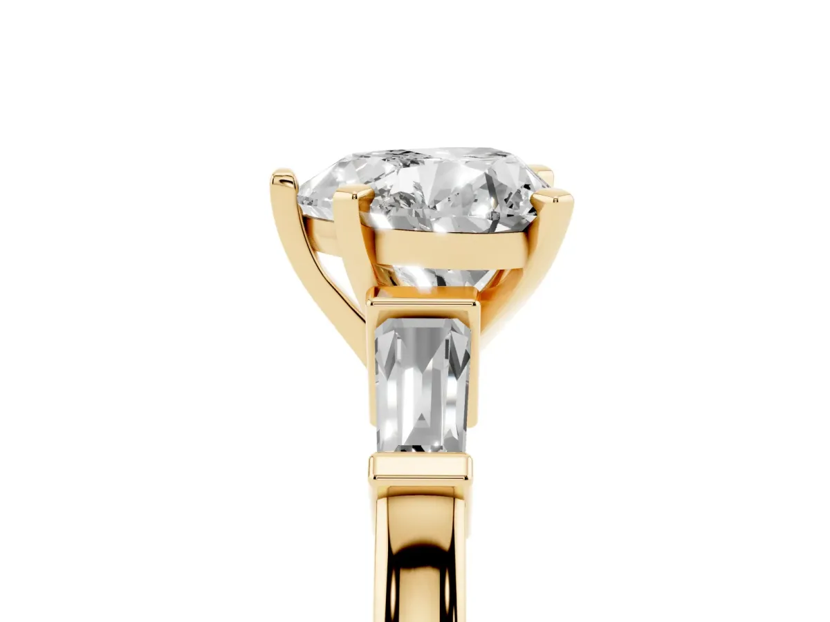 Heart Cut Cut Diamond Solitaire Ring with Tapered Baguette Accents and Four-Prong Setting Yellow gold