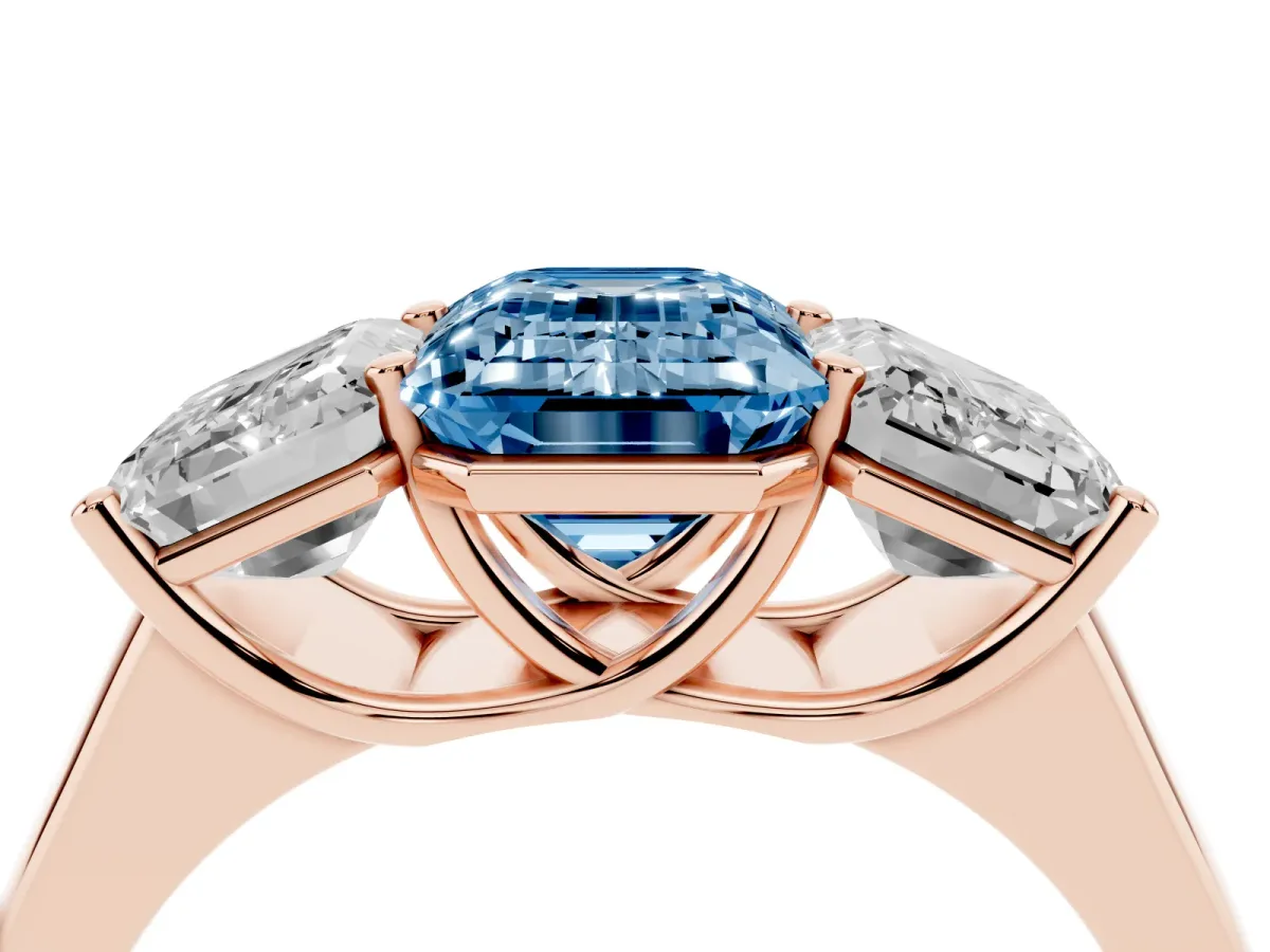Fancy Blue Emerald Cut Three-Stone Diamond Ring with Prong Setting on a Classic Band Rose gold