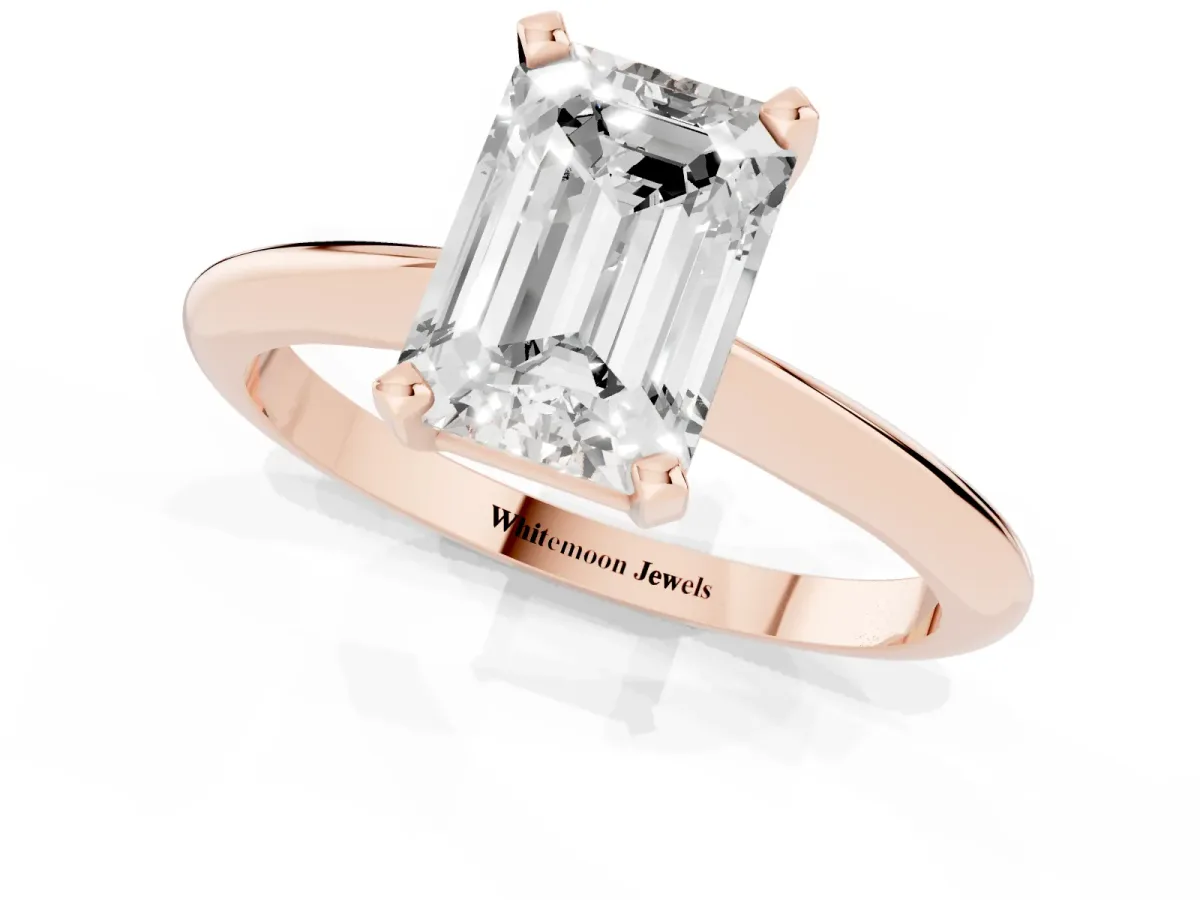 Emerald Cut Cut Solitaire Ring with Four-Prong Setting on a Classic Band Rose gold