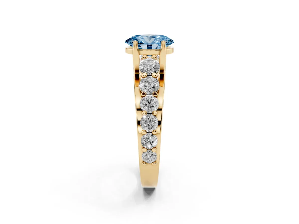 Fancy Blue Oval Cut Diamond Engagement Ring with Pavé Band and Four-Prong Setting Yellow gold