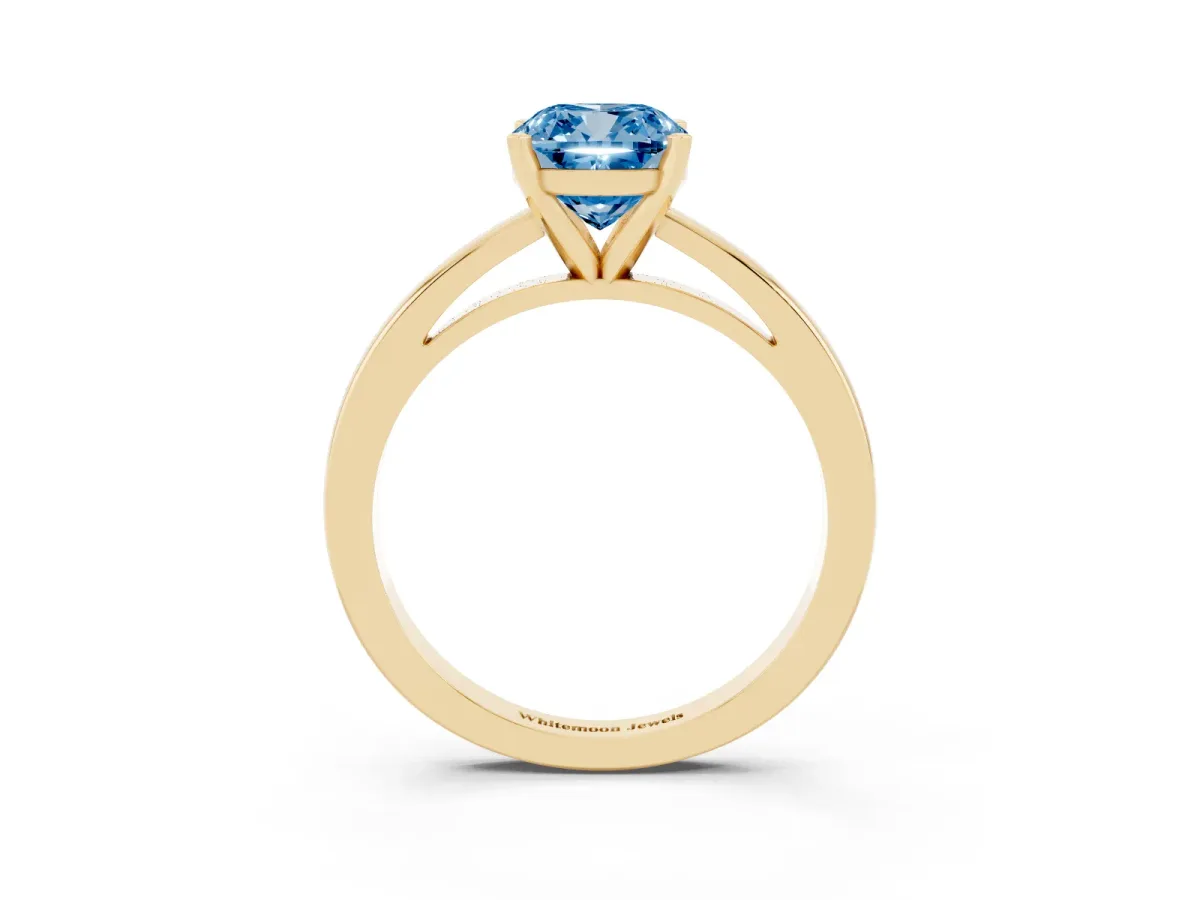 Fancy Blue Cushion Cut Solitaire Diamond Engagement Ring with Four-Prong Setting on a Classic Band Yellow gold
