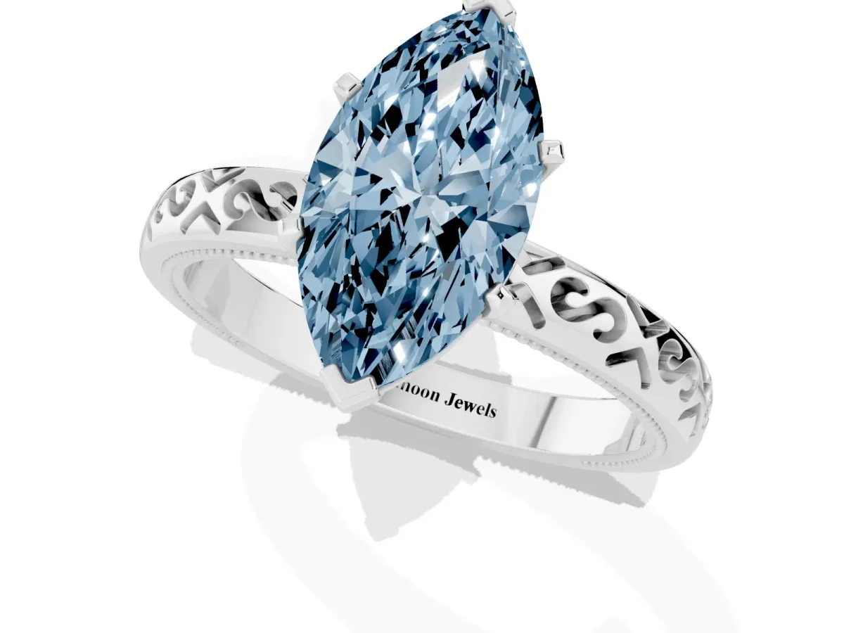 Fancy Blue Marquise Cut Solitaire Engagement Ring with Scrollwork Band and Four-Prong Setting Silver