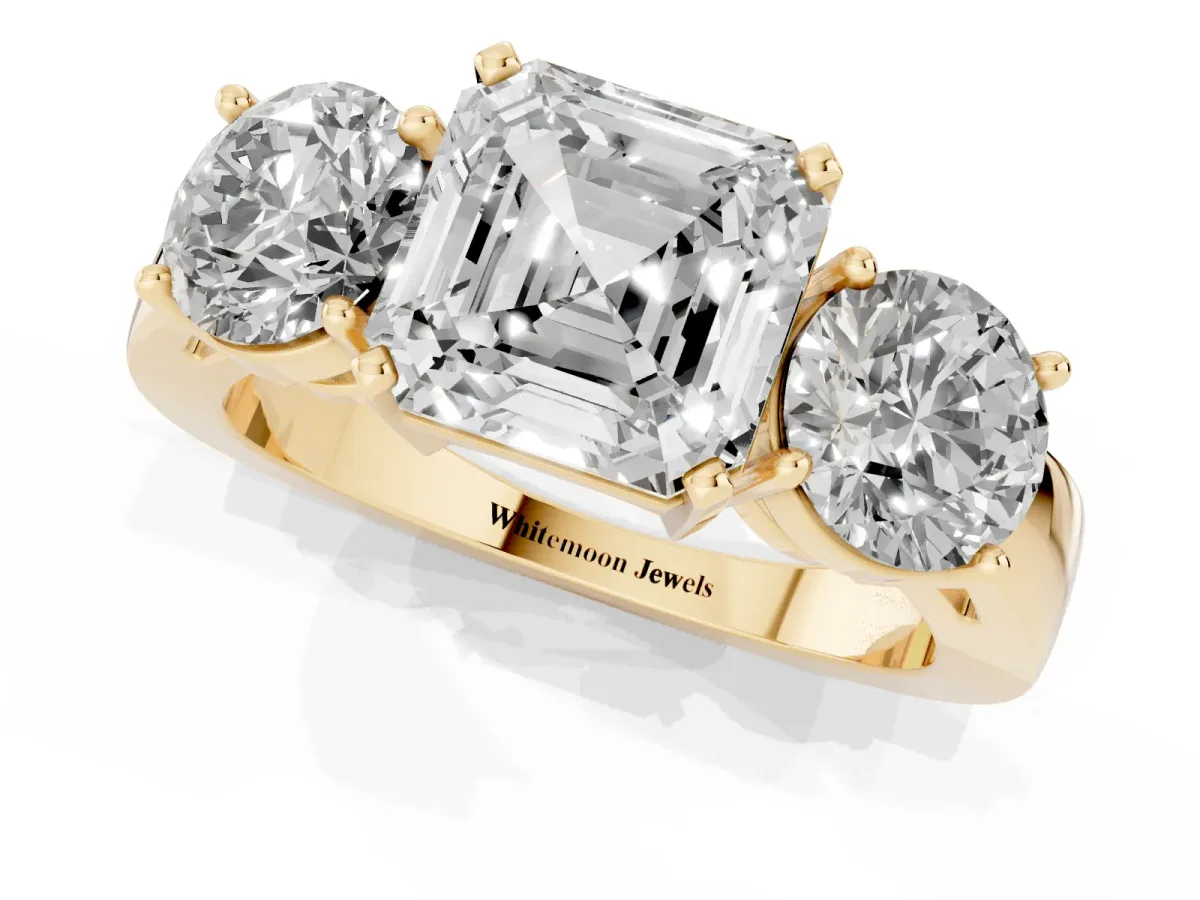 Three-Stone Asscher Cut Diamond Ring with Round Side Stones, Classic Band, and Four-Prong Setting Yellow gold