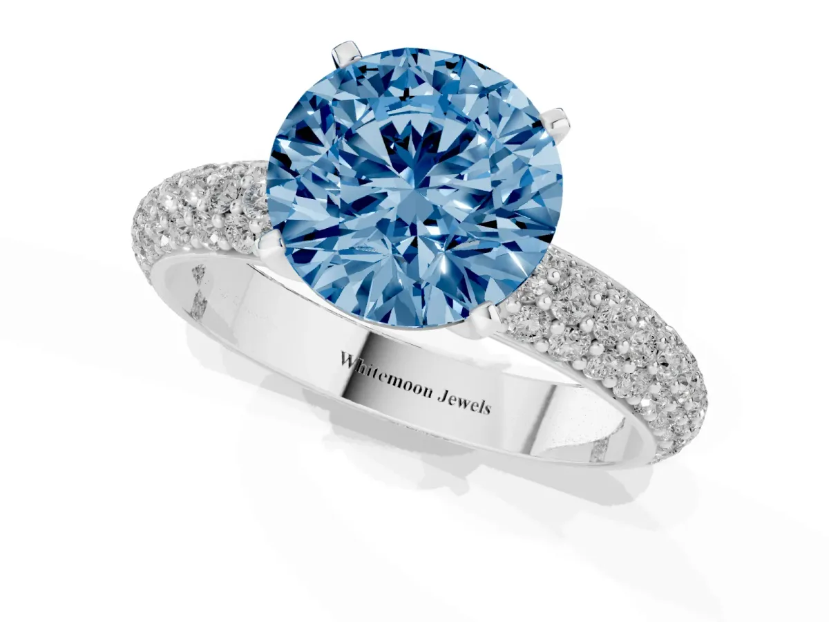 Fancy Blue Round Cut Diamond Solitaire Ring with Prong Setting and Pavé Band Platinum