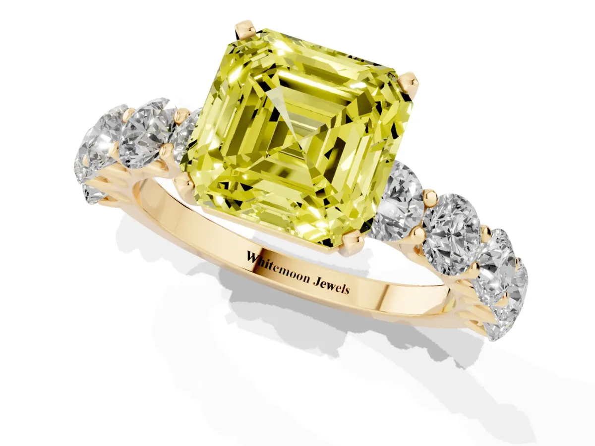 Fancy Yellow Asscher Cut Diamond Prong Setting with Side Stones on a Pave Band Yellow gold