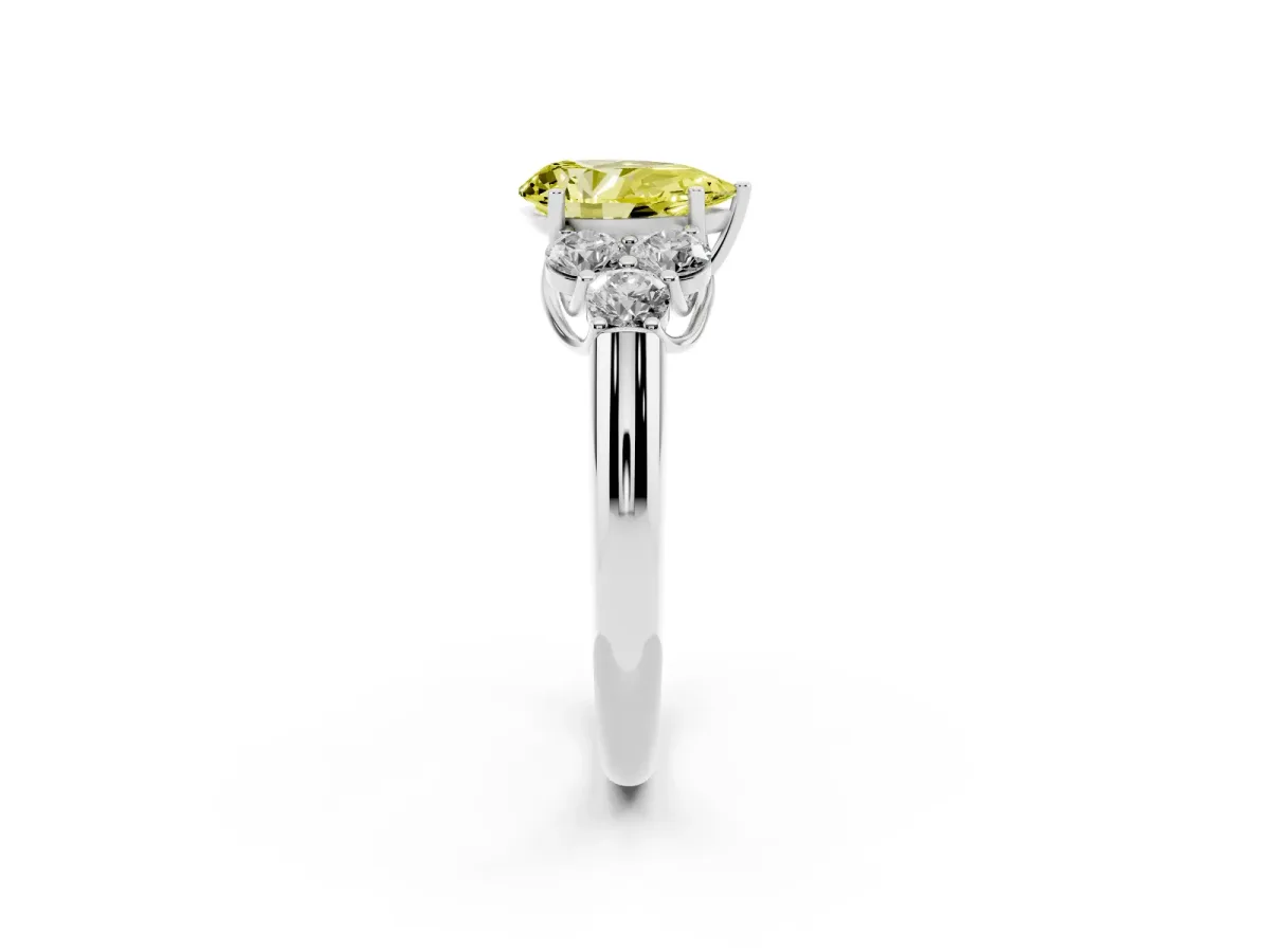 Fancy Yellow Pear Cut Cut Diamond Cluster Ring with Round Accent Stones and Prong Setting on a Classic Band Silver