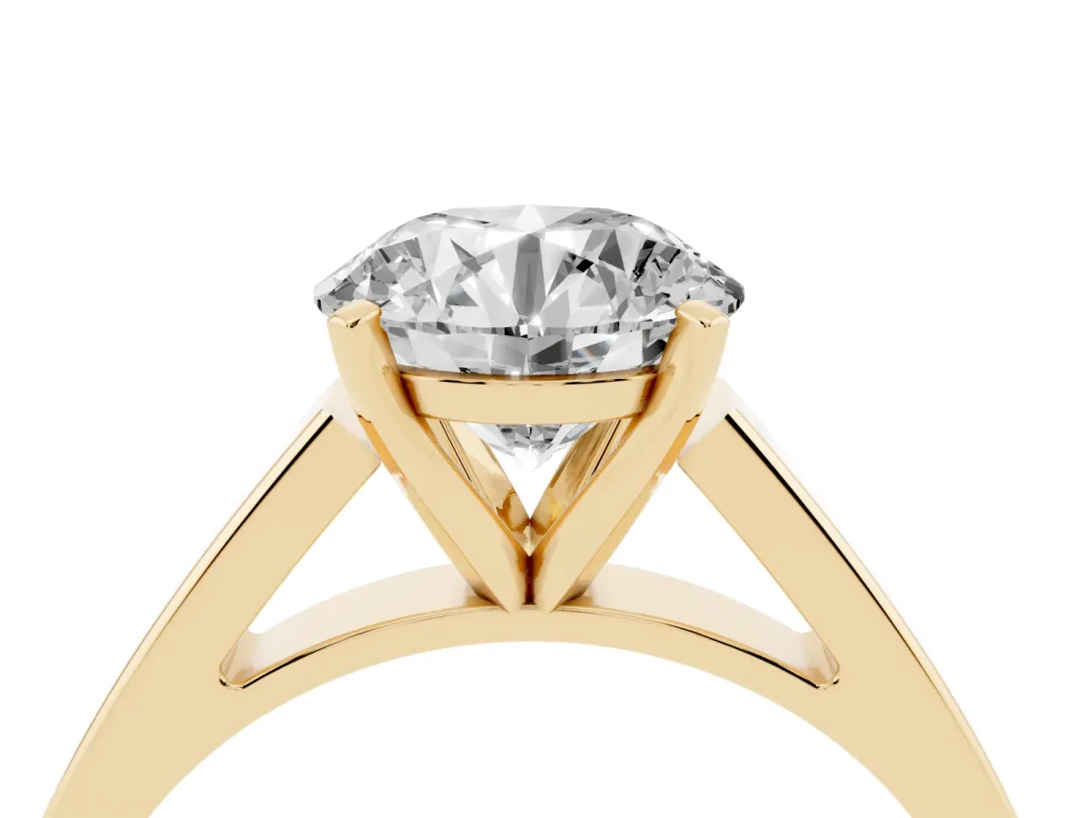 Round Cut Solitaire Engagement Ring with Four-Prong Setting and Tapered Band Yellow gold