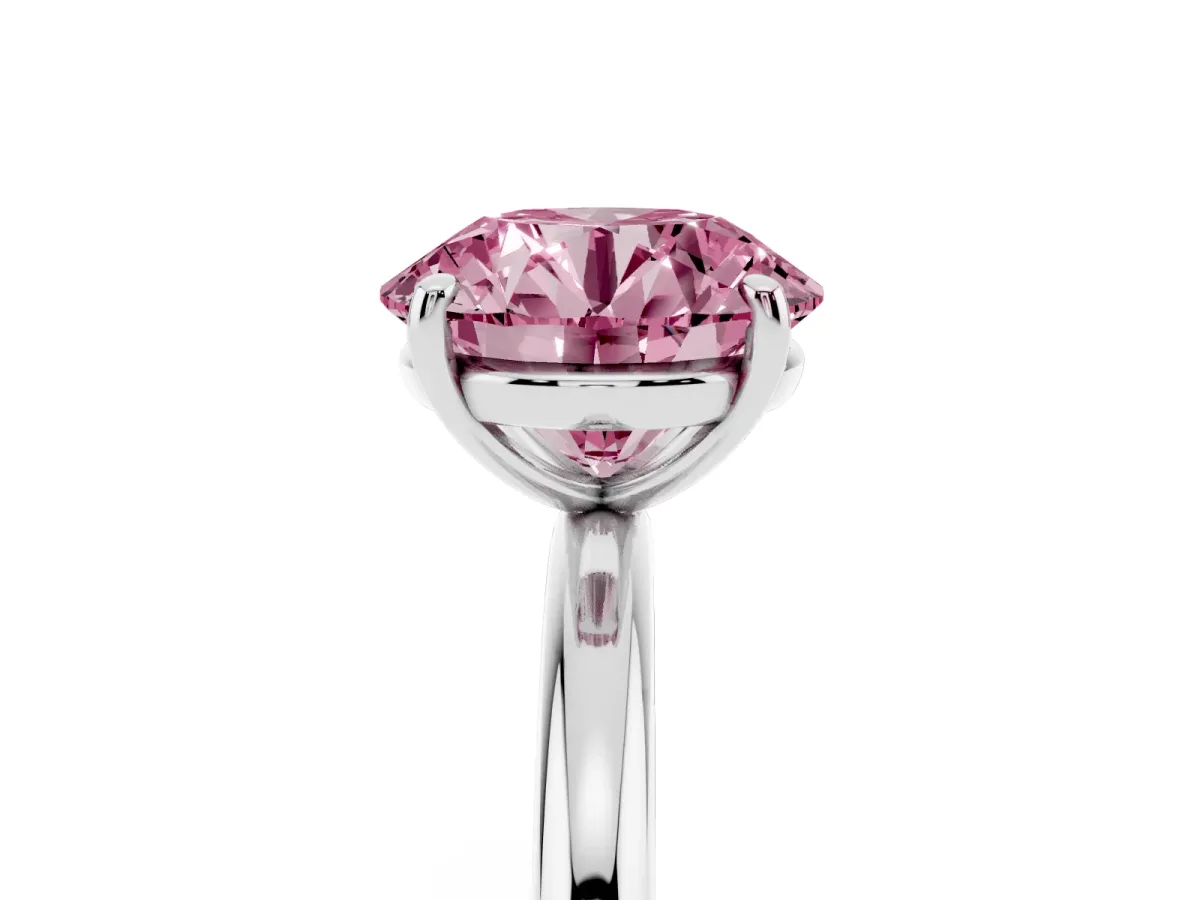 Fancy Pink Round Cut Solitaire Diamond Ring with Four-Prong Setting on a Plain Band Platinum