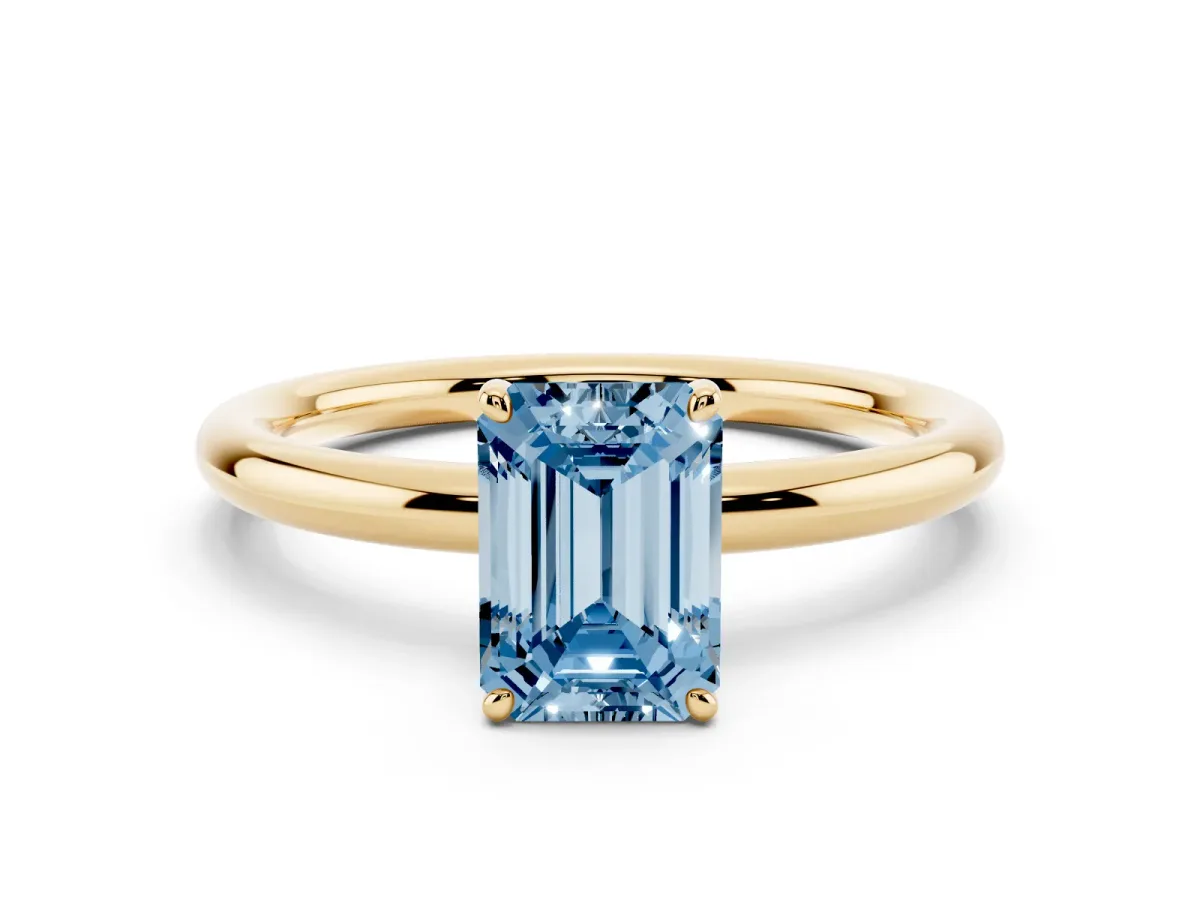 Fancy Blue Emerald Cut Solitaire Diamond Ring with Four-Prong Setting on a Plain Band Yellow gold