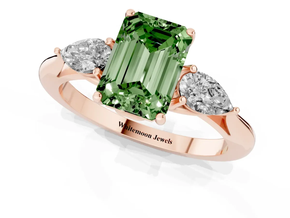 Fancy Green Three-Stone Emerald Cut Diamond Ring with Pear Side Stones in Four-Prong Setting Rose gold