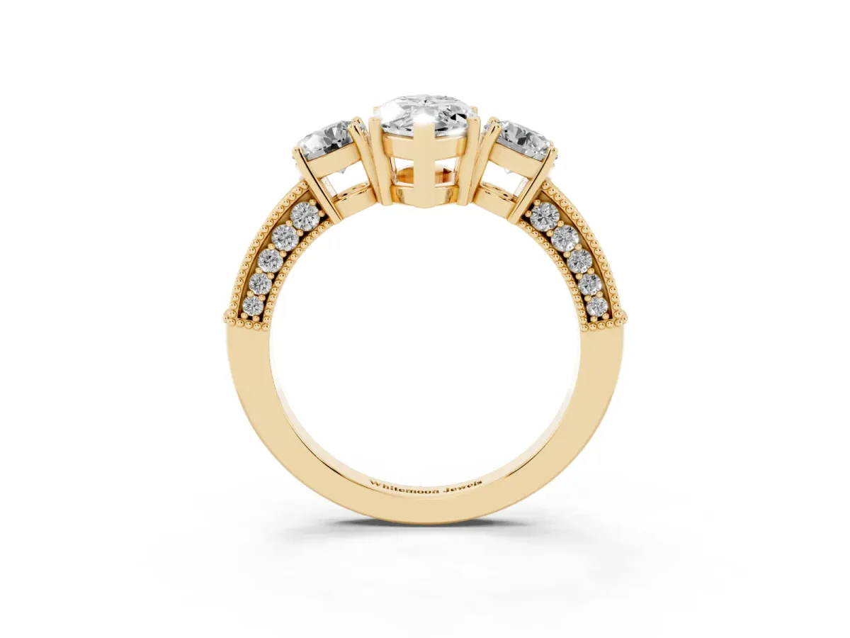 Marquise Cut Three-Stone Diamond Ring with Pavé Band and Four-Prong Setting Yellow gold